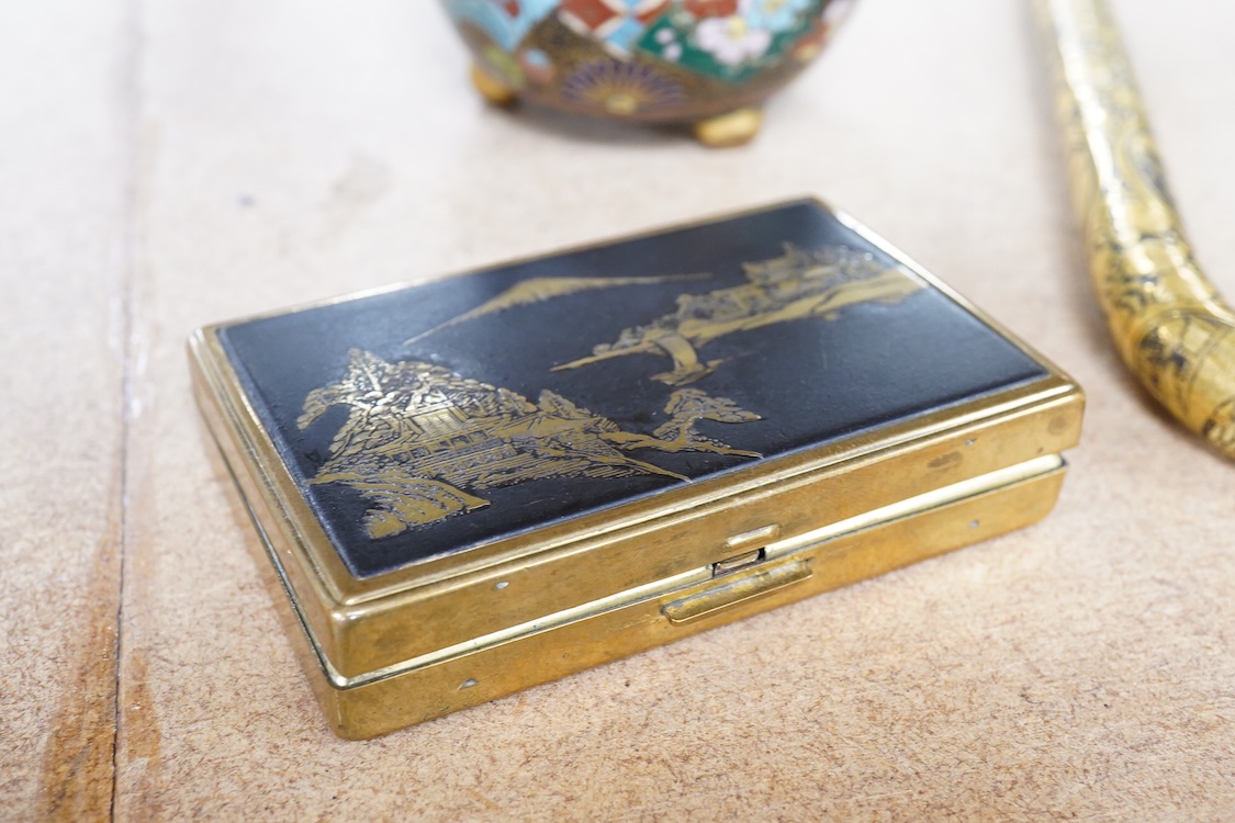 A Japanese damascened iron parasol handle, a cloisonné enamel koro and Komai style mirrored musical compact, largest 24cm in length